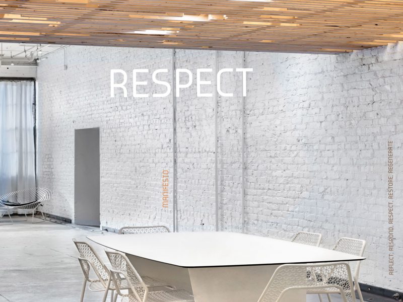 A modern interior featuring white brick walls and the text "Respect"